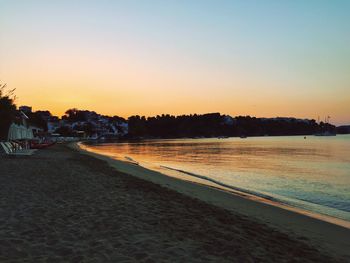 Scenic view of beach against sky during sunset