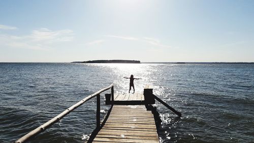 Pier over sea against sky