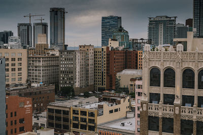 High angle view of buildings in city against sky