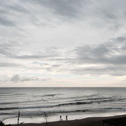 Scenic view of sea against cloudy sky