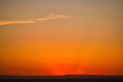 Scenic view of sea against romantic sky at sunset