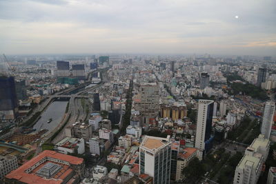 High angle view of modern buildings in city against sky