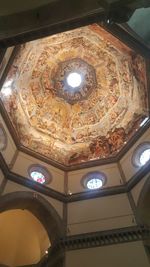 Low angle view of illuminated ceiling