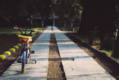 Close-up of bicycle on retaining wall