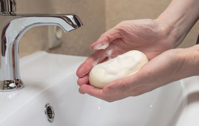 Cropped hand washing hands