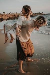 Woman standing on beach