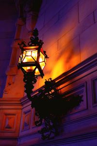 Low angle view of illuminated building against sky