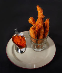 High angle view of orange in plate on table