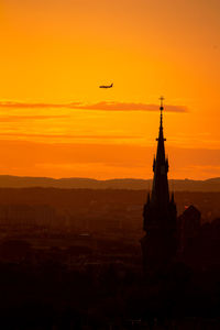 Low angle view of buildings against sky during sunset