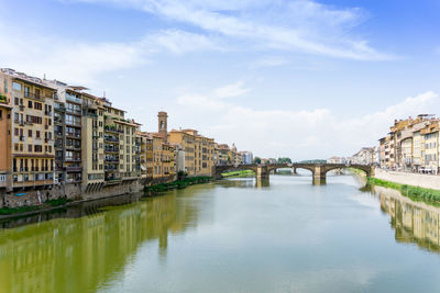 Ponte santa trinita bridge over arno river against sky