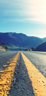 Surface level of road against mountain range