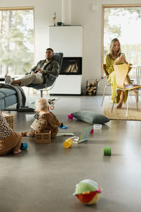 Family resting in living room