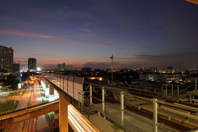 High angle view of illuminated bridge against sky at night