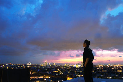 Full length of silhouette man standing against sky during sunset