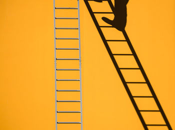 Full frame shot of yellow umbrella against clear sky
