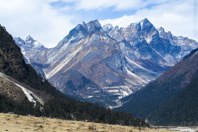 Scenic view of snowcapped mountains against sky