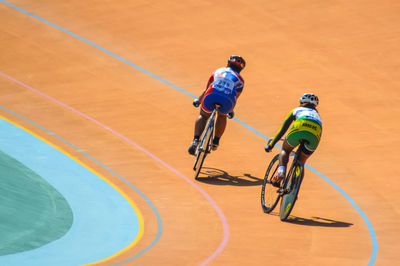 Men riding bicycle