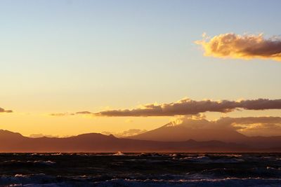 Scenic view of sea against clear sky during sunset