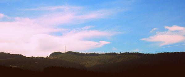 Scenic view of landscape against cloudy sky