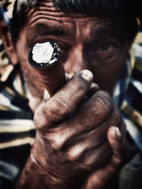 Close-up of man holding ice cream