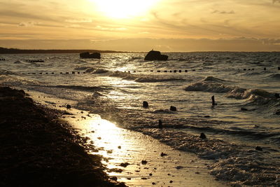 Scenic view of sea against sky during sunset