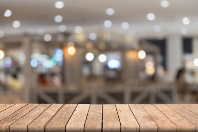 Blurred motion of illuminated lights on table at night