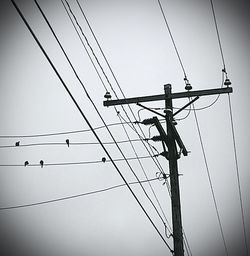 Low angle view of electricity pylon