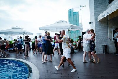 Group of people walking in swimming pool