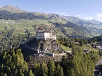 High angle view of buildings and mountains against sky