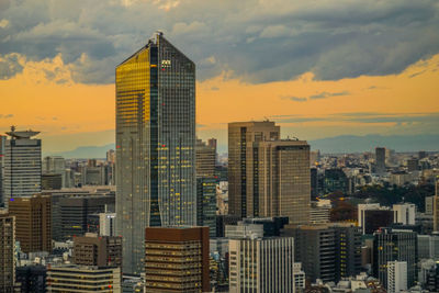 Cityscape against sky during sunset