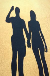 Shadow of people on sand