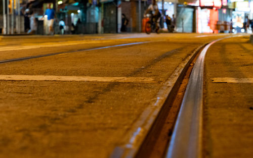 Close-up of railroad track at night