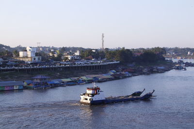 Nautical vessel on river against clear sky