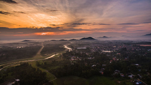 High angle view of cityscape against sky at sunset