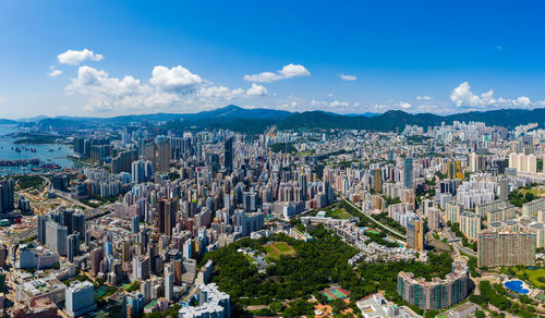 High angle view of modern buildings in city against sky