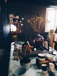 Close-up of flower vase on table at home