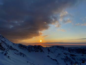 Evening sunset over snowy peaks and the black sea