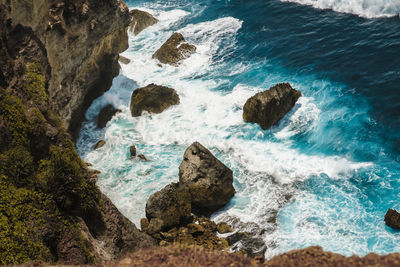 High angle view of rocks in sea