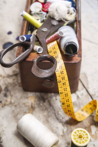 High angle view of various sewing items on table