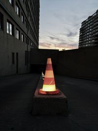 Street light on road against buildings in city