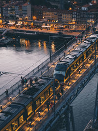 High angle view of illuminated bridge over river in city