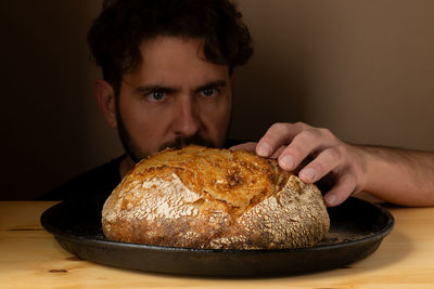 Cropped image of man holding food