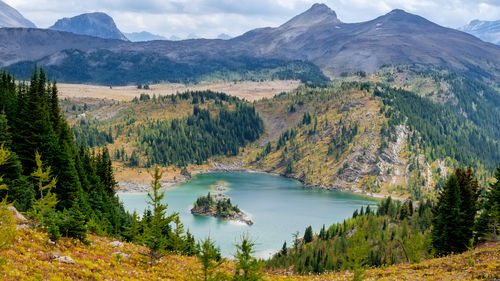 Scenic view of lake and mountains against sky