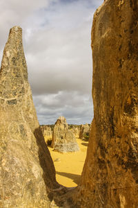 Panoramic view of old ruins against sky