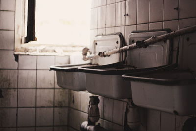 Close-up of faucet in bathroom