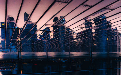 Low angle view of buildings against sky at dusk
