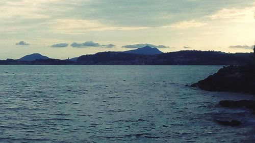 Scenic view of sea against cloudy sky