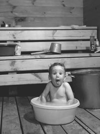 Portrait of cute baby boy in bathtub