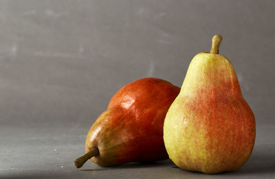 Close-up of apple on table against white background