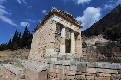 Low angle view of old ruins against sky